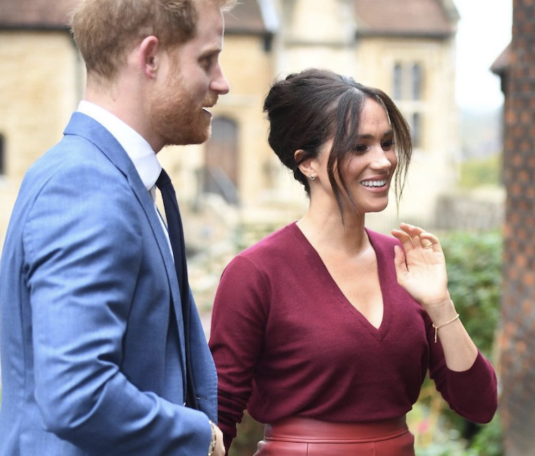 prince harry and meghan markle in blue british royal family