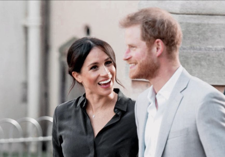 prince harry smiling meghan markle royal family august 2022