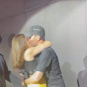 Enrique Iglesias passionately kisses a fan on the lips