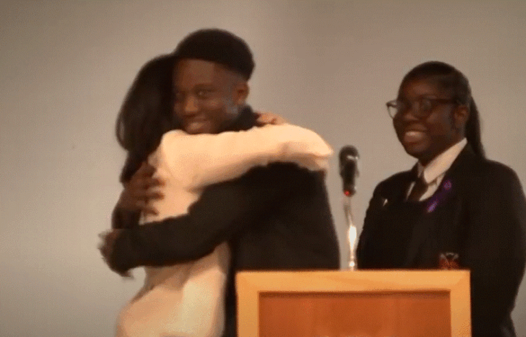 Meghan Markle hugs student